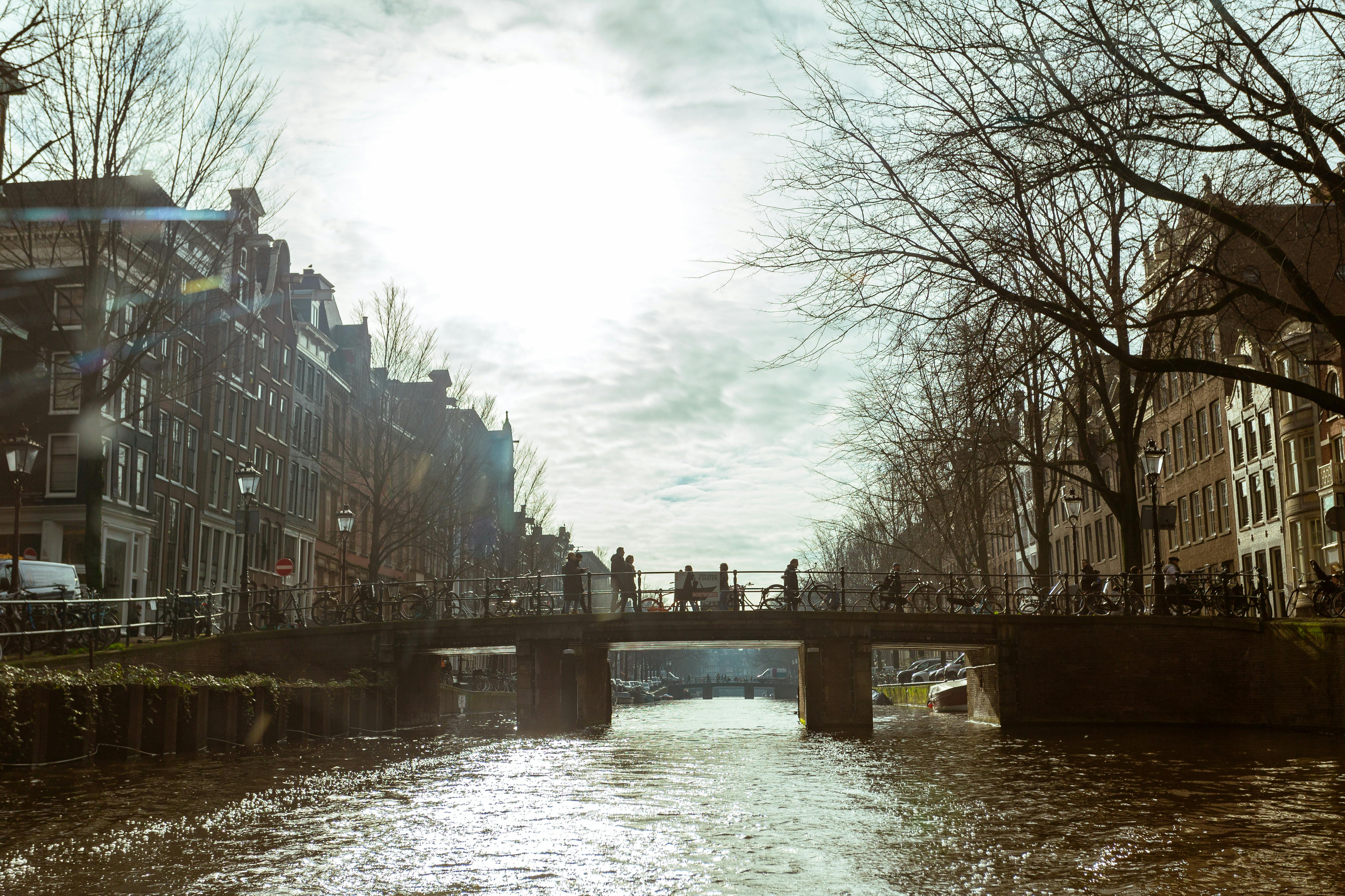 Amsterdam Travel Guide scenic view of cityscape with canals and historic buildings
