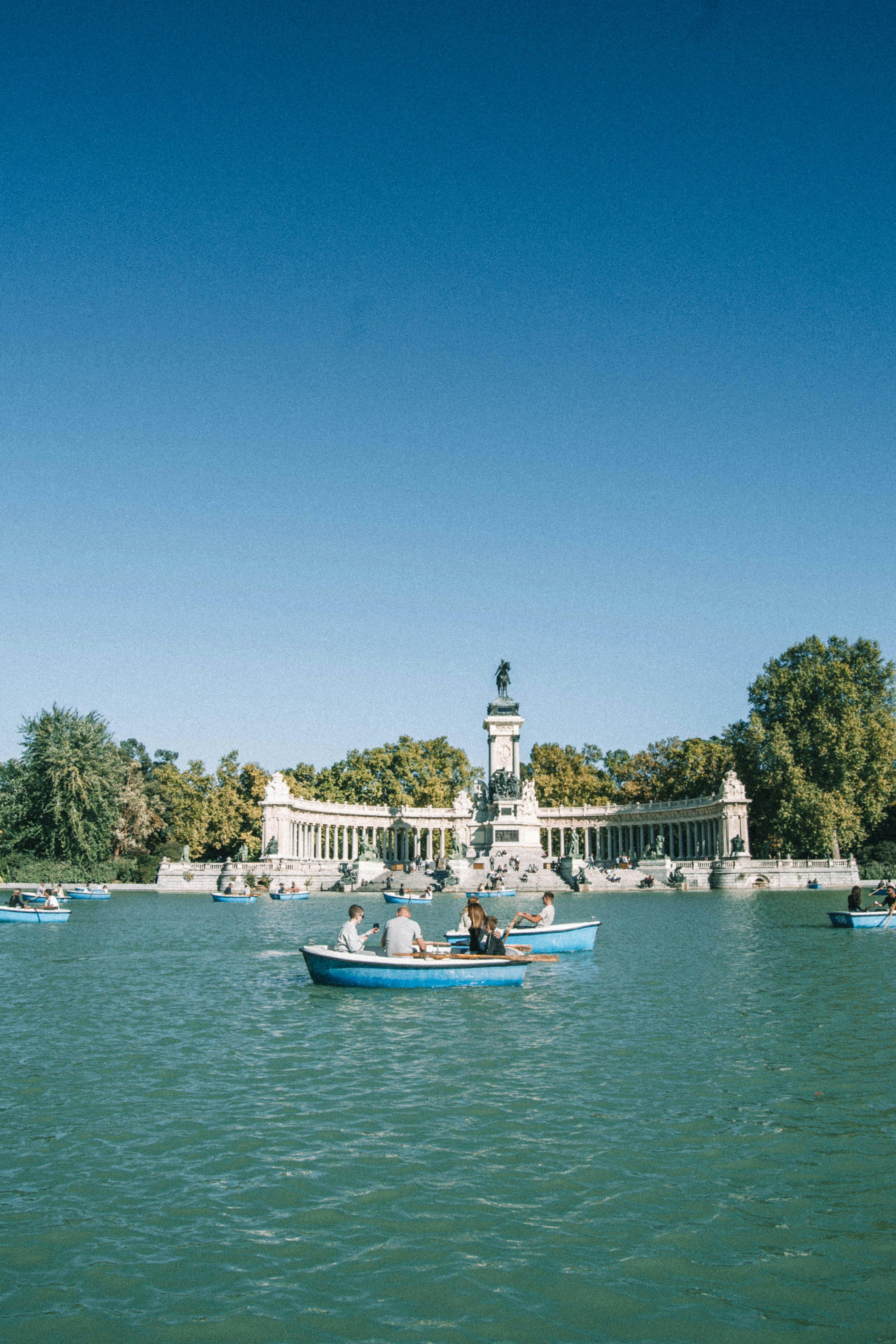 Madrid Budget Travel Guide Madrid park with lake and sculptures