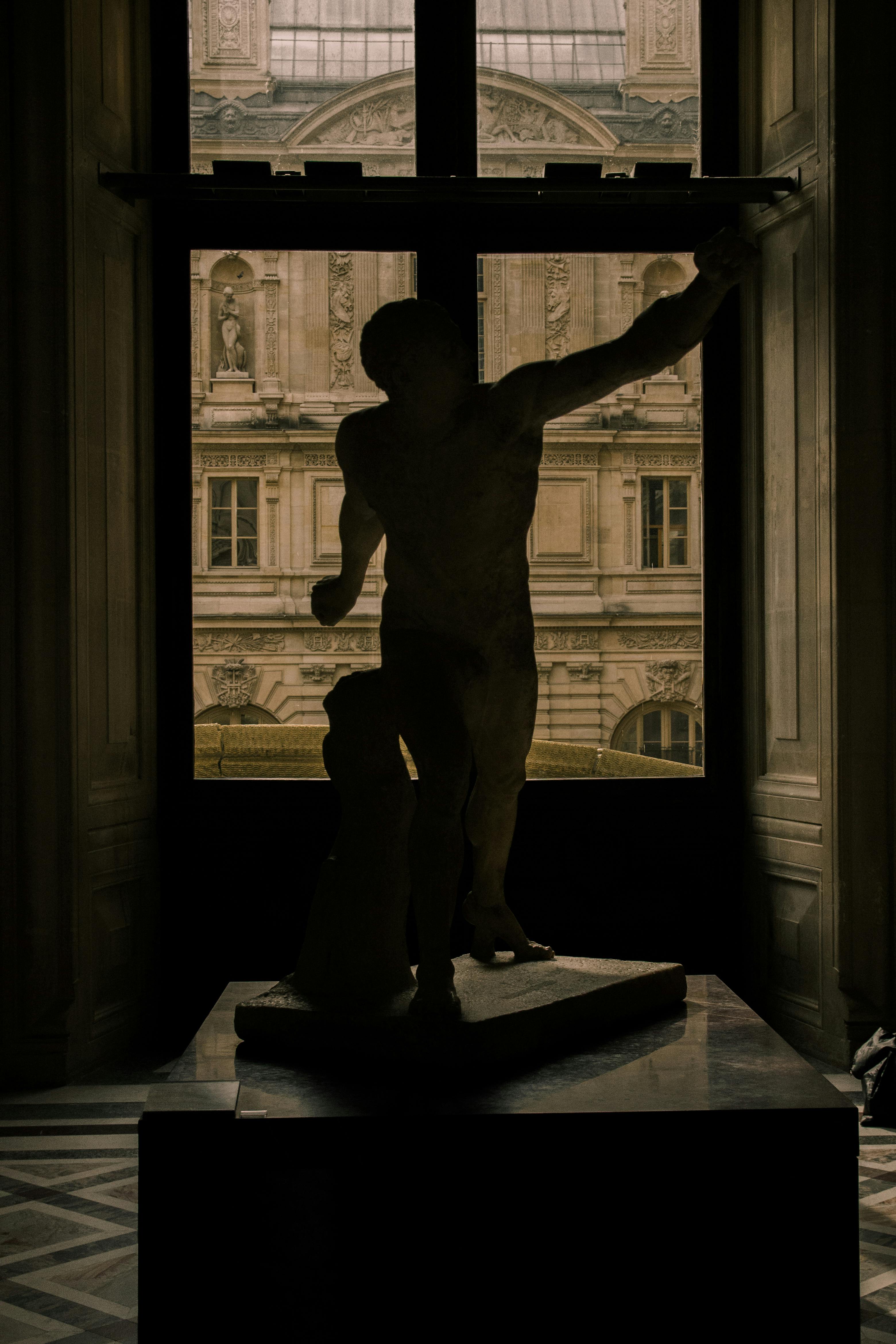 New York City Travel Guide Interior view of a grand art museum with classical sculptures